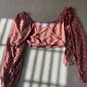 Adorable burnt orange polka dot crossover top with tie on the side
